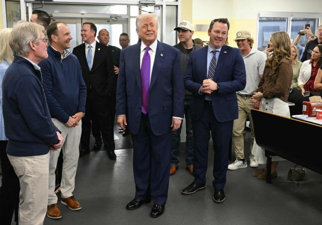 US President Donald Trump, joined by Georgia Lieutenant Governor Burt Jones (R), visits The Varsity restaurant in Rome, Georgia on February 19, 2026. (Photo by SAUL LOEB / AFP)