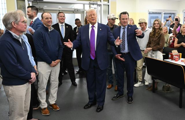 US President Donald Trump, joined by Georgia Lieutenant Governor Burt Jones (R), visits The Varsity restaurant in Rome, Georgia on February 19, 2026. (Photo by SAUL LOEB / AFP)