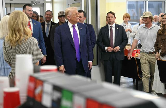 US President Donald Trump, joined by Georgia Lieutenant Governor Burt Jones (R), visits The Varsity restaurant in Rome, Georgia on February 19, 2026. (Photo by SAUL LOEB / AFP)