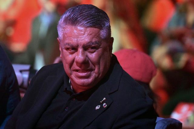 (FILES) The president of the Argentine Football Association (AFA) Claudio Tapia gestures while attending the FIFA Trophy World Tour ahead of the 2026 World Cup in the US, Canada and Mexico, in Buenos AIres, on February 19, 2026. A court has barred Claudio "Chiqui" Tapia from leaving the country and summoned him to testify next March 5 over a complaint filed by Argentina's ARCA tax collection agency over alleged tax evasion and misappropriation of social security funds, according to the ruling cited by media on February 19, 2026. (Photo by JUAN MABROMATA / AFP)