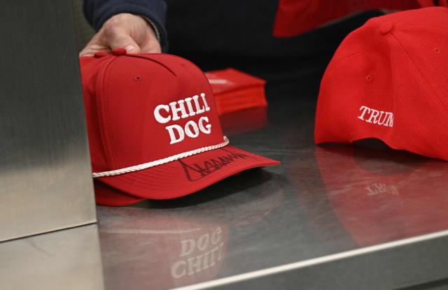 Chili Dogs hats signed by US President Donald Trump are seen on a counter at The Varsity restaurant in Rome, Georgia, on February 19, 2026. (Photo by SAUL LOEB / AFP)