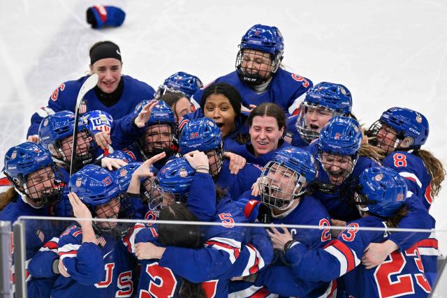 USA's players celebrate winning the women's ice hockey at the Milano Santagiulia Ice Hockey Arena during the Milano Cortina 2026 Winter Olympic Games in Milan, on February 19, 2026. (Photo by Alexander NEMENOV / AFP)