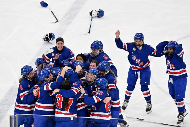 USA's players celebrate winning the women's ice hockey at the Milano Santagiulia Ice Hockey Arena during the Milano Cortina 2026 Winter Olympic Games in Milan, on February 19, 2026. (Photo by Alexander NEMENOV / AFP)