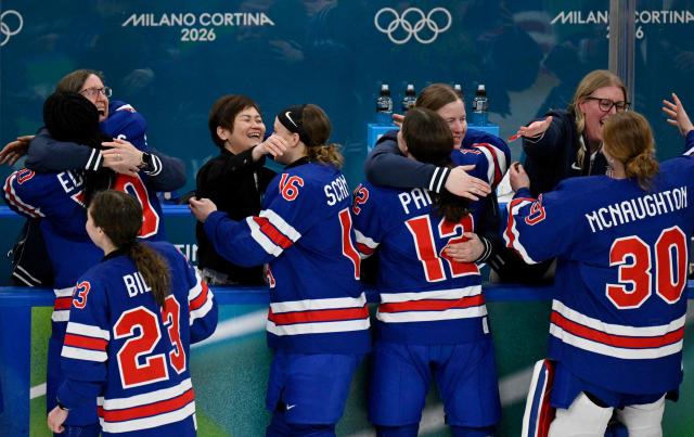 USA's players celebrate with team members prior the medal ceremony for the women's ice hockey at the Milano Santagiulia Ice Hockey Arena during the Milano Cortina 2026 Winter Olympic Games in Milan, on February 19, 2026. (Photo by Alexander NEMENOV / AFP)