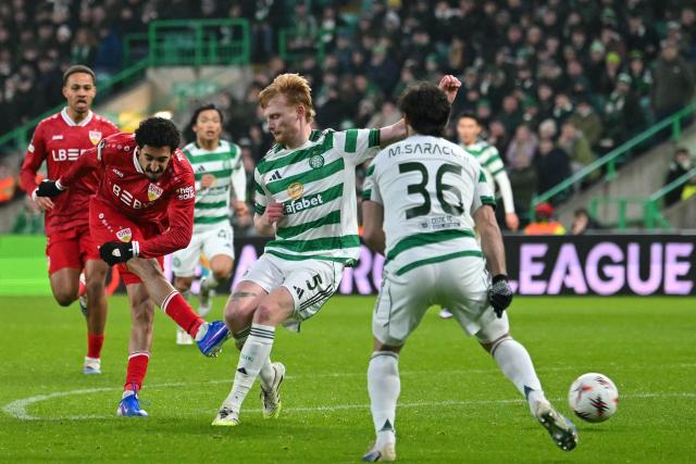 Stuttgart's Portuguese striker #08 Tiago Tomás (L) shoots but fails to score during the UEFA Europa League knockout round playoff, 1st leg football match between Celtic and Stuttgart at Celtic Park in Glasgow on February 19, 2026. (Photo by ANDY BUCHANAN / AFP)