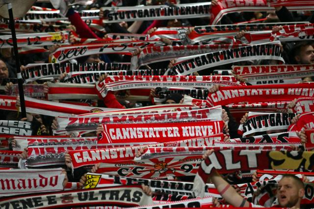 Stuttgart fans entertain themselves during the UEFA Europa League knockout round playoff, 1st leg football match between Celtic and Stuttgart at Celtic Park in Glasgow on February 19, 2026. (Photo by ANDY BUCHANAN / AFP)