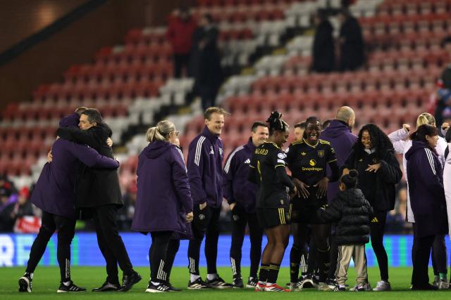 United players celebrate on the pitch after the UEFA Women's Champions League, knockout round playoff, 2nd leg football match between Manchester United and Atletico Madrid at the Progress With Unity Stadium in Leigh, western Manchester, on February 19, 2026. United won the game 2-0, (5-0 on aggregate) (Photo by Darren Staples / AFP)