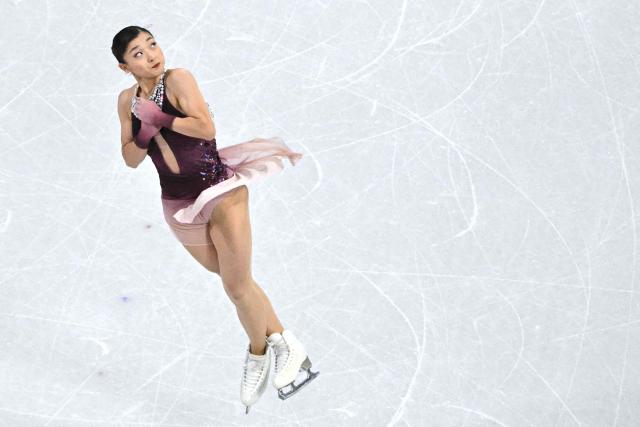 Japan's Kaori Sakamoto competes in the figure skating women's single free skating final during the Milano Cortina 2026 Winter Olympic Games at Milano Ice Skating Arena in Milan on February 19, 2026. (Photo by Antonin THUILLIER / AFP)