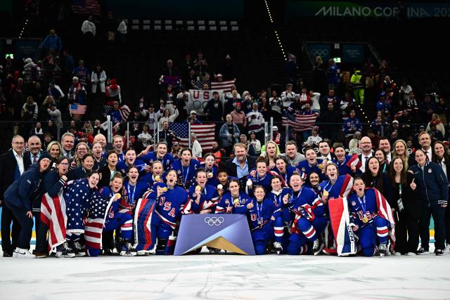 Gold medallists USA pose during the medals ceremony for the women's ice hockey event at the Milano Santagiulia Ice Hockey Arena during the Milano Cortina 2026 Winter Olympic Games in Milan, on February 19, 2026. (Photo by JULIEN DE ROSA / AFP)