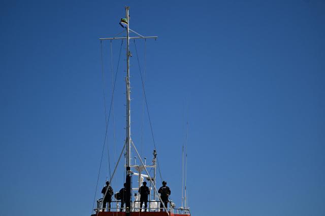 Navy officers remain aboard the vessel FMS Eagle, registered under the flag of Tanzania, from which a shipment of cocaine was seized, off the La Union Naval Base in El Salvador on February 19, 2026. El Salvador's Navy seized 6.6 tons of cocaine in Pacific waters, more than 700 kilometers off the coast of the Central American country, President Nayib Bukele said on the night of February 15, highlighting that it is the "largest seizure in the country’s history." (Photo by MARVIN RECINOS / AFP)