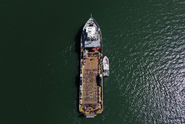 This aerial view shows a shipment of cocaine seized from the vessel FMS Eagle, registered under the flag of Tanzania, aboard the ship at the La Union Naval Base in El Salvador on February 19, 2026. El Salvador's Navy seized 6.6 tons of cocaine in Pacific waters, more than 700 kilometers off the coast of the Central American country, President Nayib Bukele said on the night of February 15, highlighting that it is the "largest seizure in the country's history." (Photo by Marvin RECINOS / AFP)