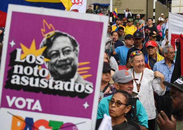 Supporters of Colombian President Gustavo Petro demonstrate in Medellin, Colombia on February 19, 2026, to back the vital minimum wage decree, which was provisionally suspended by the Council of State. (Photo by Jaime SALDARRIAGA / AFP)