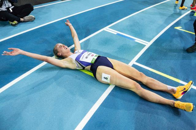 Britain's Keely Hodgkinson celebrates after breaking the world record in the 800m women final at the Athletics meeting "Hauts-de-France Pas-de-Calais" as part of the World Indoor Tour Gold, in Lievin, northern France on February 19, 2026. (Photo by Sameer Al-DOUMY / AFP)