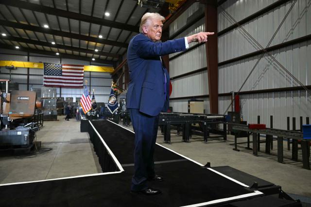 US President Donald Trump points at the end of his speech after touring the Coosa Steel Corporation factory in Rome, Georgia, February 19, 2025. (Photo by SAUL LOEB / AFP)