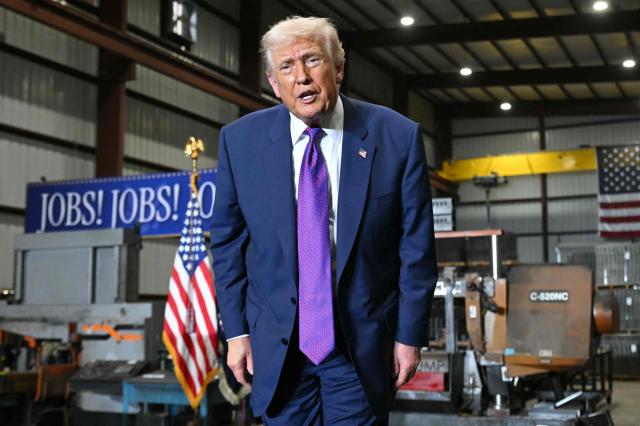 US President Donald Trump gestures at the end of his speech after touring the Coosa Steel Corporation factory in Rome, Georgia, February 19, 2025. (Photo by SAUL LOEB / AFP)