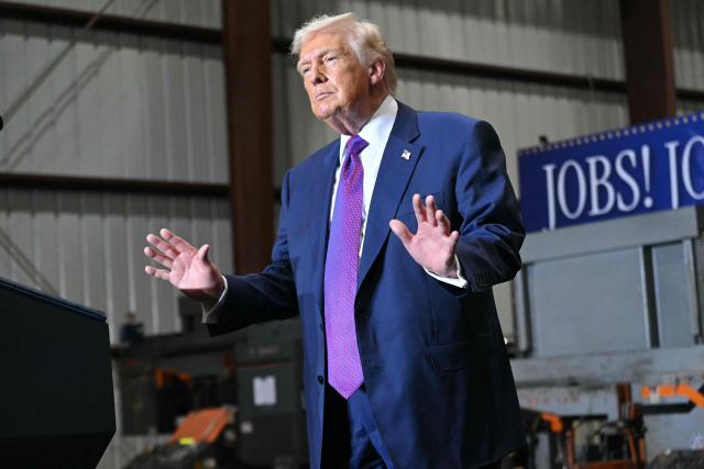 US President Donald Trump gestures at the end of his speech after touring the Coosa Steel Corporation factory in Rome, Georgia, February 19, 2025. (Photo by SAUL LOEB / AFP)
