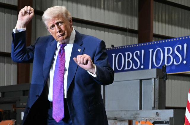 US President Donald Trump dances at the end of his speech after touring the Coosa Steel Corporation factory in Rome, Georgia, February 19, 2025. (Photo by SAUL LOEB / AFP)