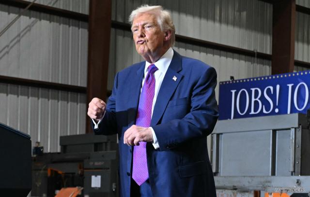 US President Donald Trump dances at the end of his speech after touring the Coosa Steel Corporation factory in Rome, Georgia, February 19, 2025. (Photo by SAUL LOEB / AFP)