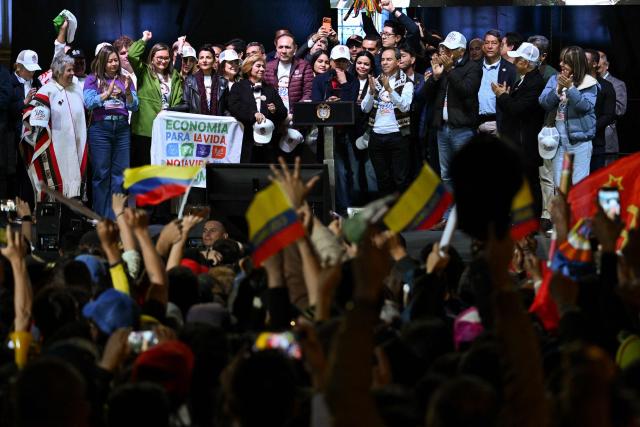 Colombia's President Gustavo Petro gives a speech to his supporters, accompanied by members of his cabinet, in Bogota on February 19, 2026, during a demonstration to back the vital minimum wage decree, which was provisionally suspended by the Council of State. (Photo by Raul ARBOLEDA / AFP)