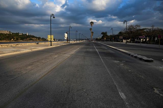 A view of an empty avenue in Havana taken on February 19, 2026. (Photo by Yamil LAGE / AFP)