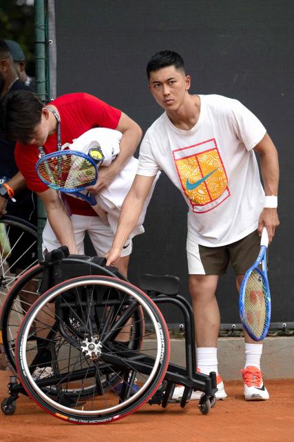 Japanese wheelchair tennis player Tokito Oda arrives at the court to a demostration training session in the framework of the ATP 500 Rio Open tournament in Rio de Janeiro, Brazil on February 18, 2026. Japan's Tokito Oda was a nine-year-old boy who dreamed of becoming a football player when he was diagnosed with bone cancer in his left leg. A decade later, he is the world number one in wheelchair tennis. (Photo by Pablo PORCIUNCULA / AFP)