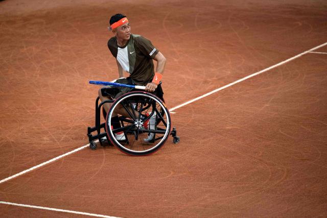 Japanese wheelchair tennis player Tokito Oda plays against Brazilian Daniel Rodrigues during the ATP 500 Rio Open tournament in Rio de Janeiro, Brazil on February 19, 2026. Japan's Tokito Oda was a nine-year-old boy who dreamed of becoming a football player when he was diagnosed with bone cancer in his left leg. A decade later, he is the world number one in wheelchair tennis. (Photo by Pablo PORCIUNCULA / AFP)