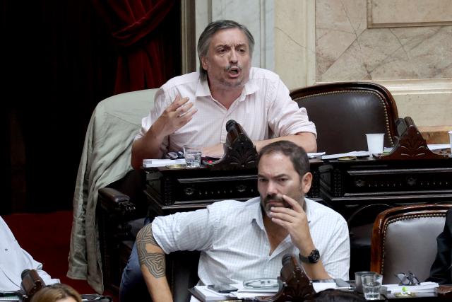 Argentine deputy Maximo Kirchner speaks during a session to debate labor law reforms at the National Congress in Buenos Aires, early on February 20, 2026. The contested reforms pushed by Argentina's President Javier Milei would make it easier to hire and fire workers in a country where job security is already hard to come by. It would also reduce severance pay, limit the right to strike, increase work hours and restrict holiday provisions. (Photo by Tomas CUESTA / AFP)