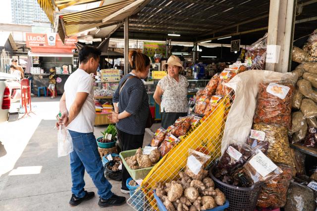 People visit a market in downtown Vientiane on February 19, 2026. (Photo by AFP)