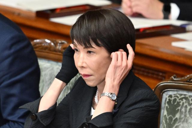 Japan's Prime Minister Sanae Takaichi prepares to deliver her policy speech during the House of Representatives plenary session in Tokyo on February 20, 2026. (Photo by Kazuhiro NOGI / AFP)