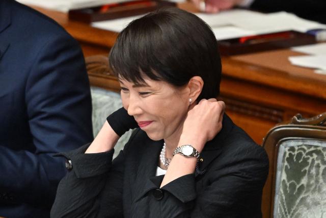 Japan's Prime Minister Sanae Takaichi prepares to deliver her policy speech during the House of Representatives plenary session in Tokyo on February 20, 2026. (Photo by Kazuhiro NOGI / AFP)