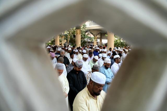 Muslim devotees offer their first Friday prayers of the Islamic holy fasting month of Ramadan, at Jama Masjid in Hyderabad on February 20, 2026. (Photo by Noah SEELAM / AFP)