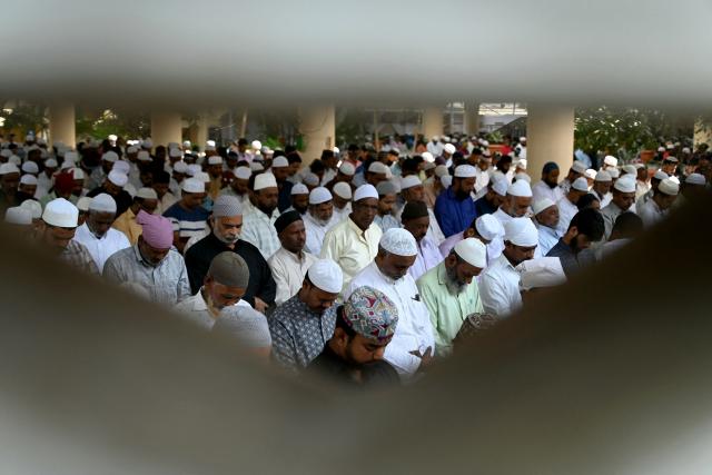 Muslim devotees offer their first Friday prayers of the Islamic holy fasting month of Ramadan, at Jama Masjid in Hyderabad on February 20, 2026. (Photo by Noah SEELAM / AFP)