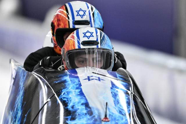 Team Israel including pilot Israel's Adam Edelman (bottom C) take part in the bobsleigh men's 4-man training session at Cortina Sliding Centre during the Milano Cortina 2026 Winter Olympic Games in Cortina d'Ampezzo on February 20, 2026. (Photo by Tiziana FABI / AFP)