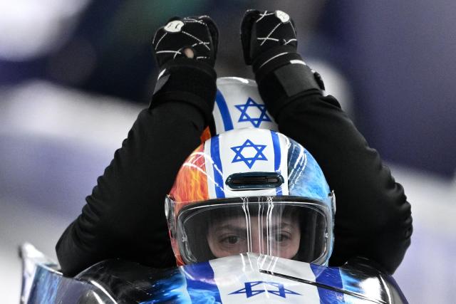 Team Israel including pilot Israel's Adam Edelman (bottom C) take part in the bobsleigh men's 4-man training session at Cortina Sliding Centre during the Milano Cortina 2026 Winter Olympic Games in Cortina d'Ampezzo on February 20, 2026. (Photo by Tiziana FABI / AFP)