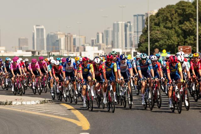 Riders compete during the fifth stage of the UAE Tour cycling race from Dubai’s Al-Mamzar Park to Hamdan Bin Mohammed Smart University in Dubai on February 20, 2026. (Photo by Fadel SENNA / AFP)