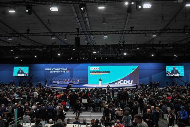 General view as German Chancellor and leader of Germany's Christian Democratic Union (CDU) Friedrich Merz (C and on screens) delivers his speech during the party congress of Germany's Christian Democratic Union (CDU) in Stuttgart, southern Germany, on February 20, 2026. (Photo by THOMAS KIENZLE / AFP)