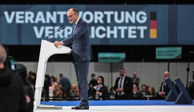 German Chancellor and leader of Germany's Christian Democratic Union (CDU) Friedrich Merz deivers his speech during the party congress of Germany's Christian Democratic Union (CDU) in Stuttgart, southern Germany, on February 20, 2026. (Photo by THOMAS KIENZLE / AFP)