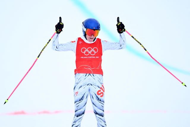 Switzerland's Fanny Smith reacts after winning the freestyle skiing women's ski cross quarter final 3 during the Milano Cortina 2026 Winter Olympic Games at Livigno Snow Park, in Livigno (Valtellina), on February 20, 2026. (Photo by Kirill KUDRYAVTSEV / AFP)