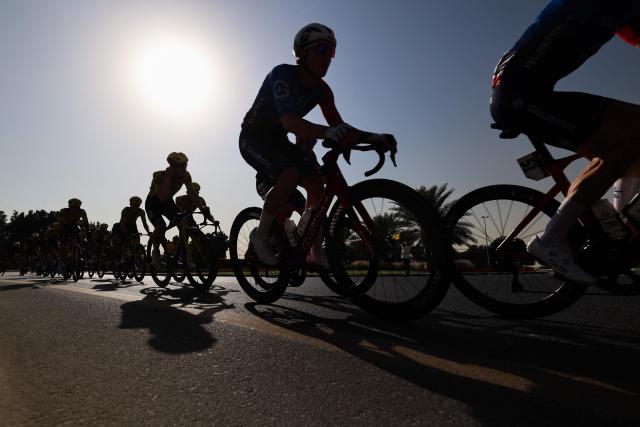 Riders compete during the fifth stage of the UAE Tour cycling race from Dubai’s Al-Mamzar Park to Hamdan Bin Mohammed Smart University in Dubai on February 20, 2026. (Photo by Fadel SENNA / AFP)