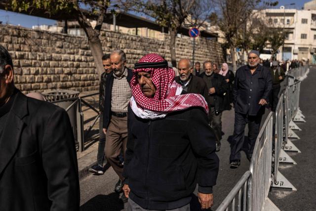 Muslim worshippers make their way to the Aqsa mosque before the first Friday noon prayers of the holy month of Ramadan in the old city of Jerusalem on February 20, 2026. (Photo by JOHN WESSELS / AFP)