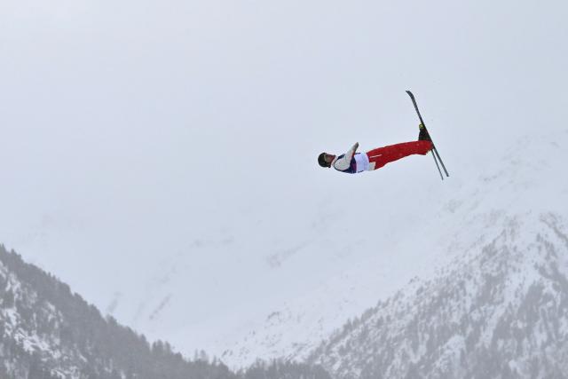 Canada's Emile Nadeau competes in the freestyle skiing men's aerials final 1 during the Milano Cortina 2026 Winter Olympic Games at Livigno Aerials & Moguls Park, in Livigno (Valtellina), on February 20, 2026. (Photo by Jeff PACHOUD / AFP)