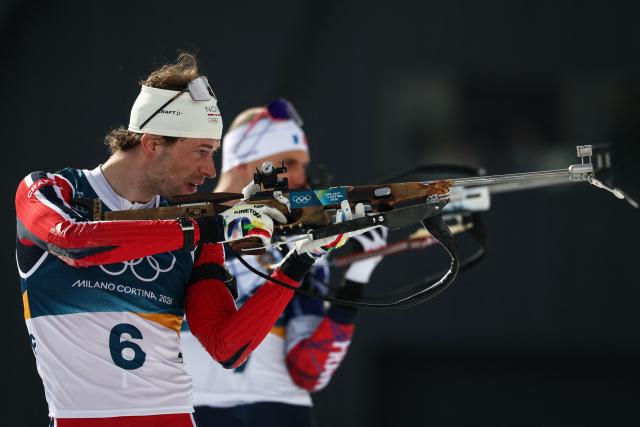 Norway's Sturla Holm Laegreid warms up at the shooting range ahead of the men's biathlon 15km mass start event during the Milano Cortina 2026 Winter Olympic Games at the Anterselva Biathlon Arena (Sudtirol Arena) in Anterselva (Val Pusteria) on February 20, 2026. (Photo by FRANCK FIFE / AFP)