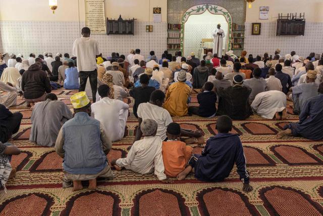 Muslim worshippers listen to the Imam's sermon on the first Friday prayers of the holy month of Ramadan at the at the Al Maida Mosque Kibera in Nairobi on February 20, 2026. (Photo by SIMON MAINA / AFP)