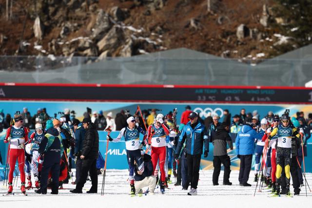 (From L) Norway's Johan-Olav Botn, France's Quentin Fillon Maillet Norway's Vetle Sjaastad Christiansen and Sweden's Martin Ponsiluoma prepare prior to take the start of the men's biathlon 15km mass start event during the Milano Cortina 2026 Winter Olympic Games at the Anterselva Biathlon Arena (Sudtirol Arena) in Anterselva (Val Pusteria) on February 20, 2026. (Photo by FRANCK FIFE / AFP)
