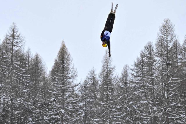 China's Li Tianma competes in the freestyle skiing men's aerials final 1 during the Milano Cortina 2026 Winter Olympic Games at Livigno Aerials & Moguls Park, in Livigno (Valtellina), on February 20, 2026. (Photo by Jeff PACHOUD / AFP)