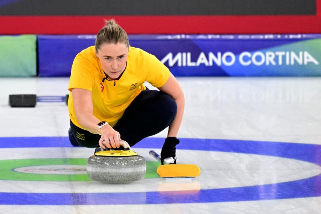 Sweden's Sara McManus competes in the curling women's round robin semi-final between Canada and Sweden during the Milano Cortina 2026 Winter Olympic Games at the Cortina Curling Olympic Stadium in Cortina d’Ampezzo on February 20, 2026. (Photo by Stefano RELLANDINI / AFP)
