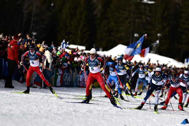 (From L) Norway's Sturla Holm Laegreid, Norway's Vetle Sjaastad Christiansen and France's Quentin Fillon Maillet compete during the men's biathlon 15km mass start event during the Milano Cortina 2026 Winter Olympic Games at the Anterselva Biathlon Arena (Sudtirol Arena) in Anterselva (Val Pusteria) on February 20, 2026. (Photo by Marco BERTORELLO / AFP)