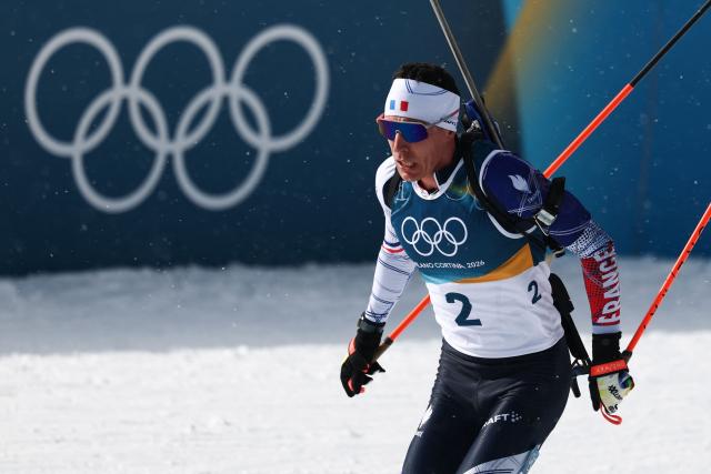 France's Quentin Fillon Maillet enters the shooting range during the men's biathlon 15km mass start event during the Milano Cortina 2026 Winter Olympic Games at the Anterselva Biathlon Arena (Sudtirol Arena) in Anterselva (Val Pusteria) on February 20, 2026. (Photo by FRANCK FIFE / AFP)