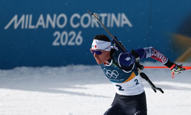 France's Quentin Fillon Maillet enters the shooting range during the men's biathlon 15km mass start event during the Milano Cortina 2026 Winter Olympic Games at the Anterselva Biathlon Arena (Sudtirol Arena) in Anterselva (Val Pusteria) on February 20, 2026. (Photo by FRANCK FIFE / AFP)