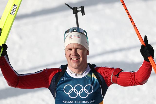 Gold medallist Norway's Johannes Dale-Skjevdal celebrates after the men's biathlon 15km mass start event during the Milano Cortina 2026 Winter Olympic Games at the Anterselva Biathlon Arena (Sudtirol Arena) in Anterselva (Val Pusteria) on February 20, 2026. (Photo by FRANCK FIFE / AFP)